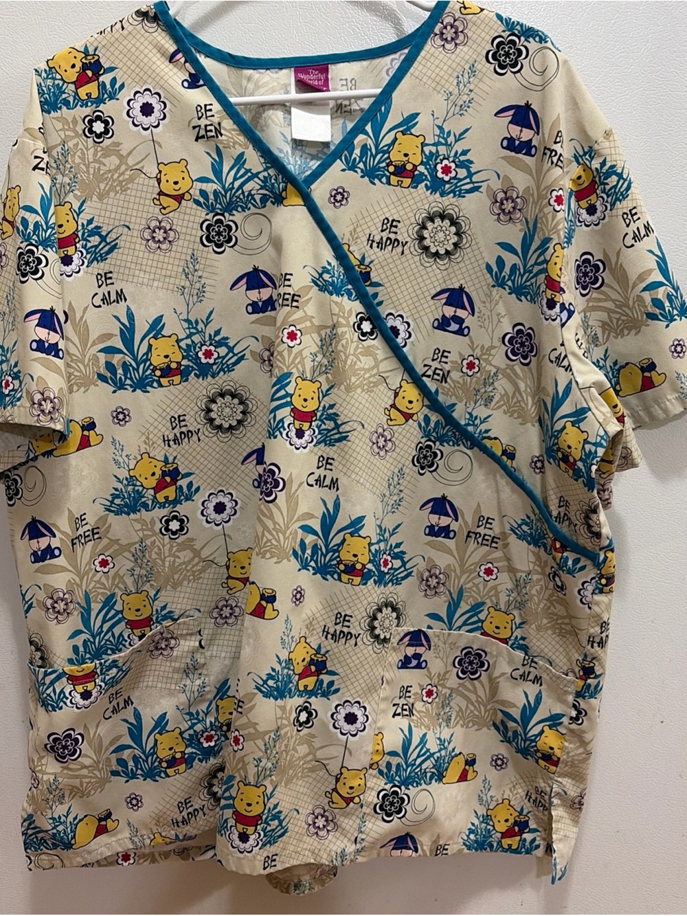 Woman’s Beige Winnie-the-Pooh Print Scrub Top - Blue Trim 2X